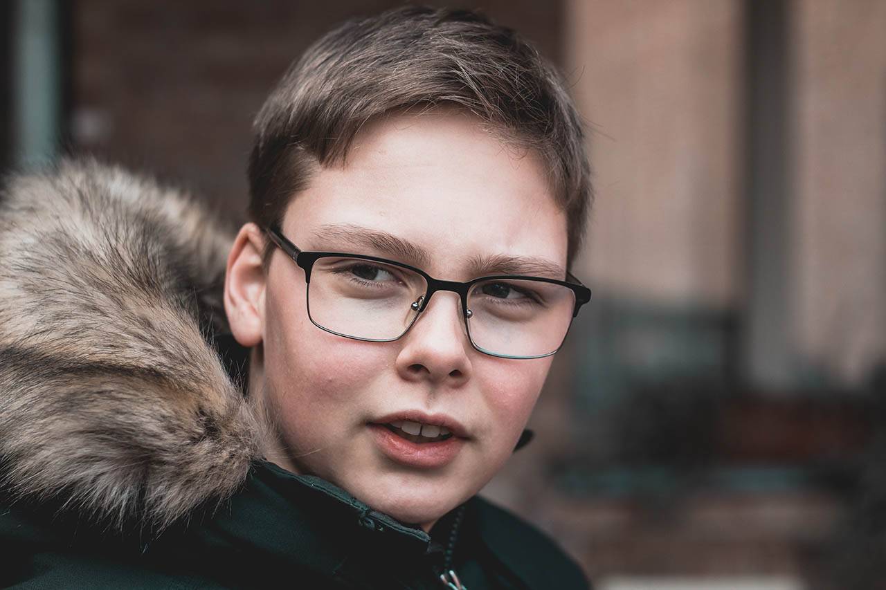 boy with glasses winter coat_1280x853